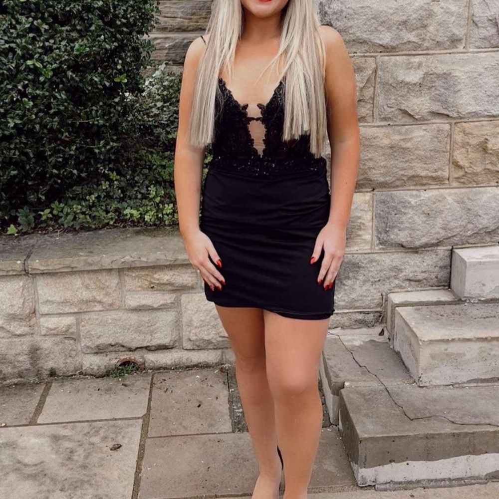 Black homecoming dress size 6 it has a corset back so it can fit 4-8